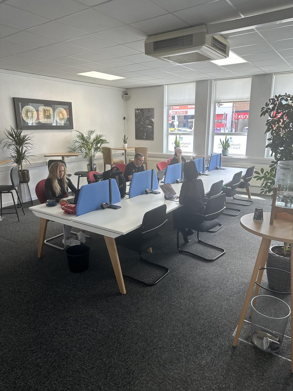 Worcester Coworking hot desk area with members working