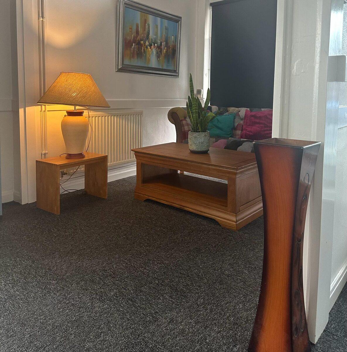 Members working together in the shared lounge area at Worcester Coworking